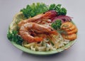 Rice noodles with royal shrimp a light green plate